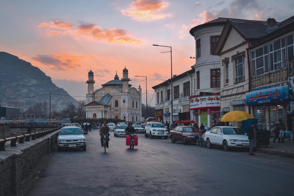 Vibrant city scene with the Shah Du Shamshire Mosque at dusk in Kabul, Afghanistan.